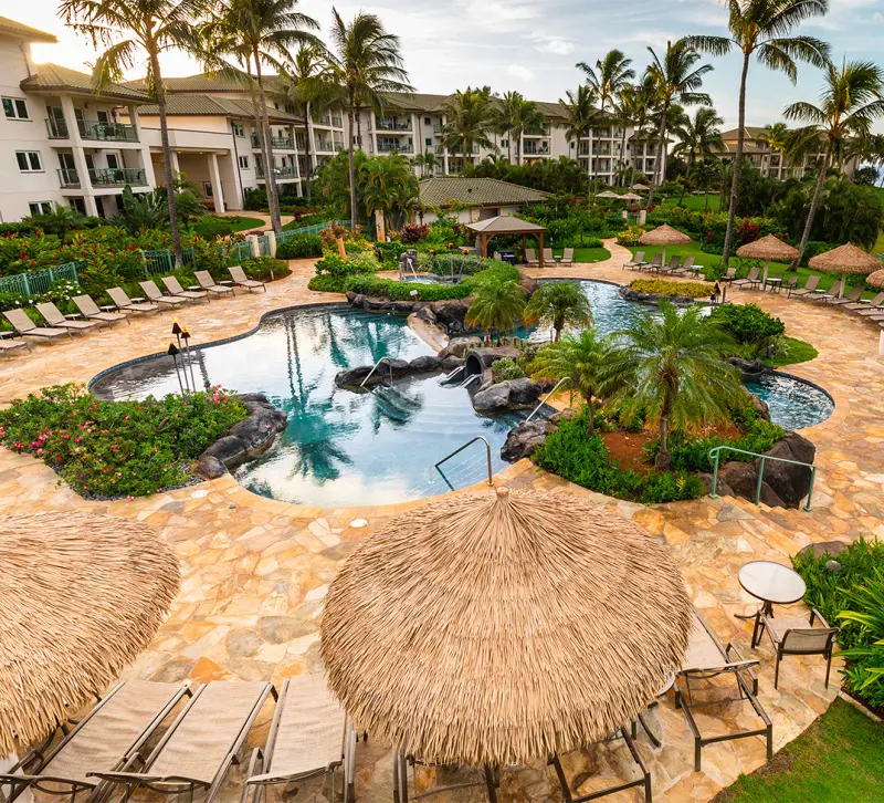 An oasis style outdoor pool and typical Hawaiian shades at Marriot Kauai Lagoons