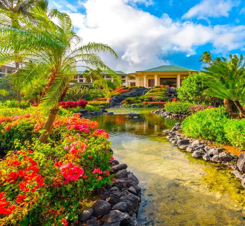 The beautiful premise of the Grand Hyatt Kauai Resort & Spa decorated with colorful flowers