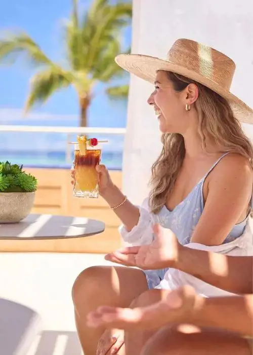 Enjoy the moring sun with complimentary cocktails at Outrigger Reef