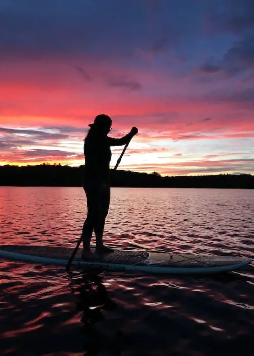 paddle boarding is a common water sport in Oahu, Hawaii