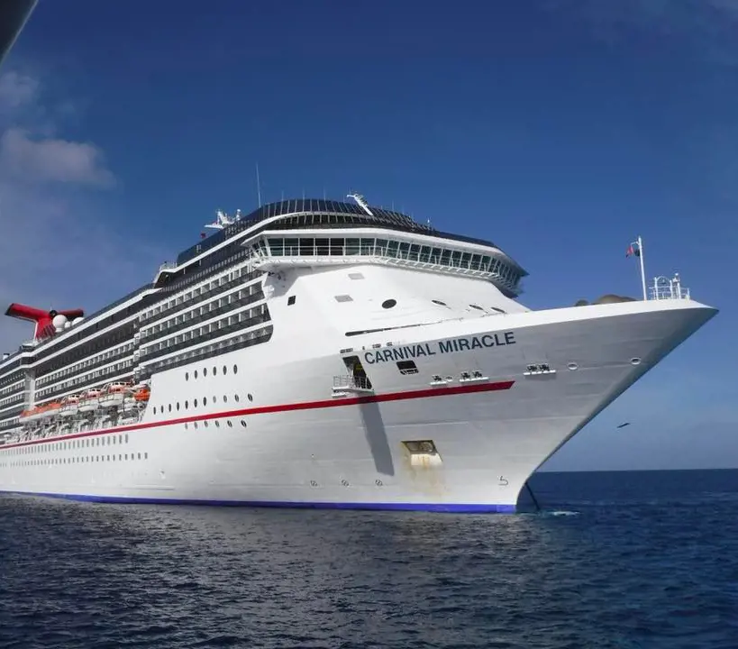The gigantic Carnival Miracle passenger ship sailing in open waters