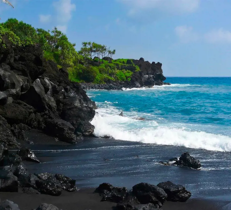 A magnificent shot of the Black Sand Beach in Hana