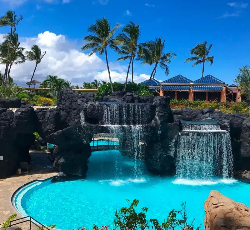 A beautiful waterfall and the outdoor pool at Hilton Waikoloa Village