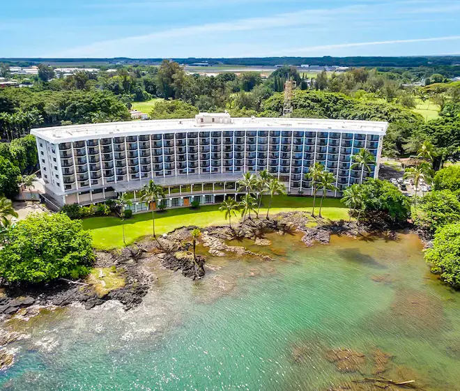 An aerial view of the Hilo Hawaiian Hotel nestled among lush tropical environment