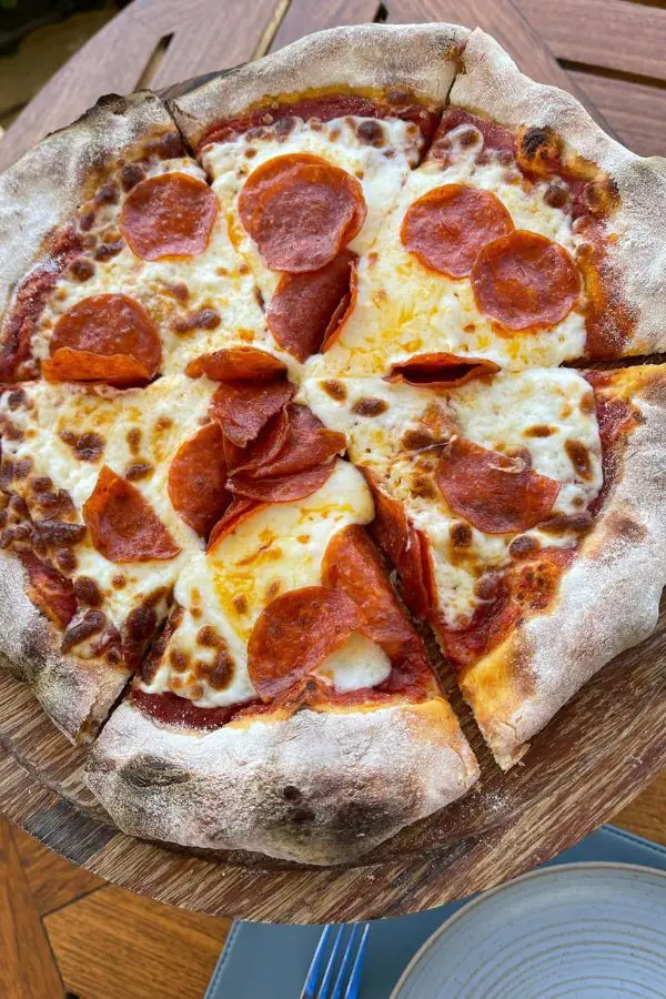 Enjoy a firewood pepperoni pizza at Ferraro’s Bar e Ristorante